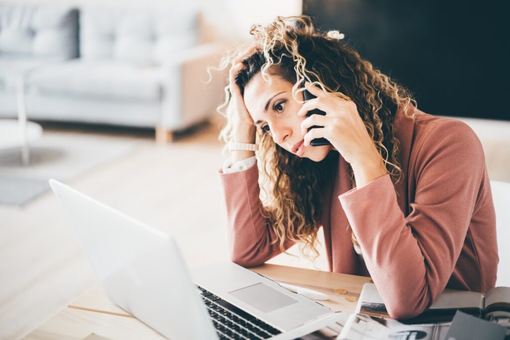frustrated woman calling while sitting on a chair