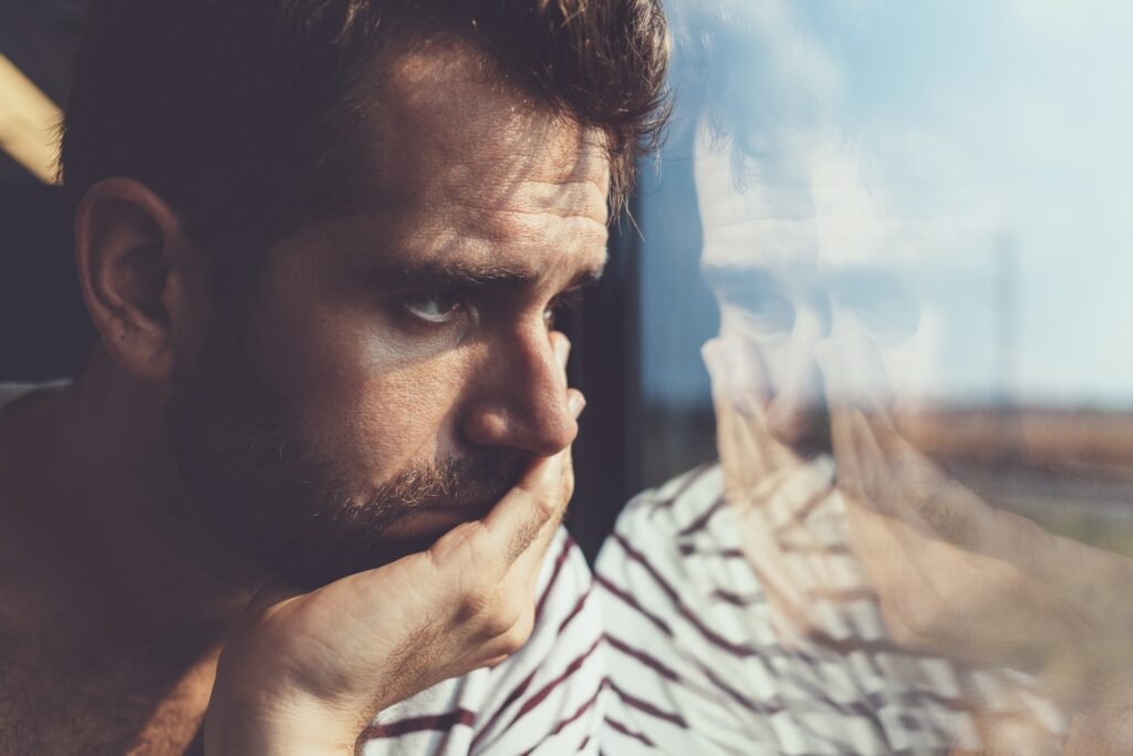 depressed man thinking of memories